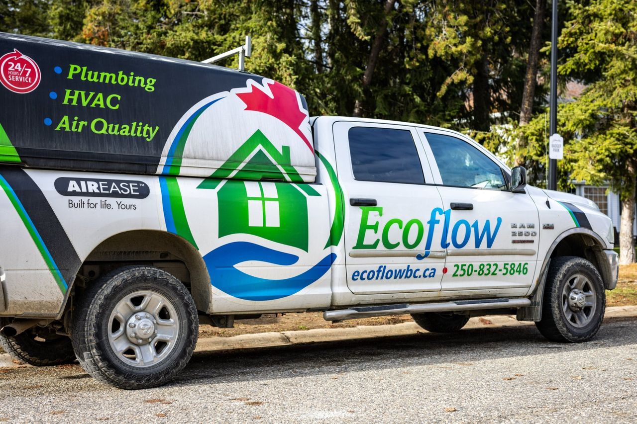 An Ecoflow service truck parked at the curb, its side wrapped with the Ecoflow logo and the Air Ease badge.